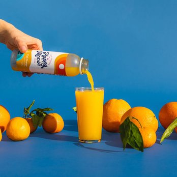Happy Moose Juice - a person pouring orange juice into a glass - Juice Bars & Smoothies Near Me - Oakland, California Happy Moose Juice - a person pouring orange juice into a glass - Juice Bars & Smoothies Near Me - Oakland, California