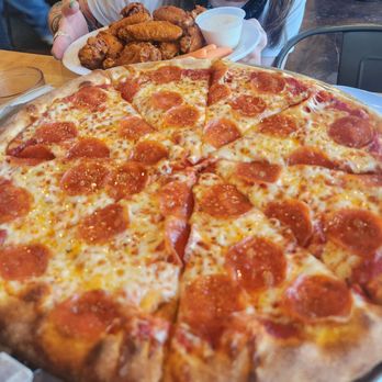 Fratelli Pizza - Pepperoni pizza and medium buffalo wings - Pizza Near Me - Flagstaff, Arizona