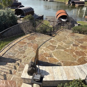 All Star Lawn and Landscape - Flagstone below pool going down to boat dock, including flower bed "wing walls." - Landscape Architects or Designers Near Me - Coldspring, Texas