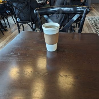 Hannah's Cafe and Bakery - a cup of coffee on a table - Coffee & Tea Near Me - Toronto, Ontario Hannah's Cafe and Bakery - a cup of coffee on a table - Coffee & Tea Near Me - Toronto, Ontario
