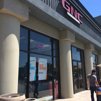 GNC - the entrance to a store with people walking by - Health Markets Near Me - South Gate, California GNC - the entrance to a store with people walking by - Health Markets Near Me - South Gate, California