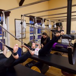 Soma Movement Studio - Group Cadillac classes include the hanging and traction exercises of the Pilates Repertoire