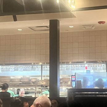 Piccolo Buco by Cooper's Hawk - The kitchen where you can see photos of the menu items and how they are to be plated - Wine Bars Near Me - Tampa, Florida