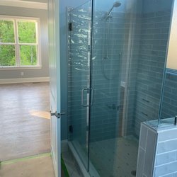 City Mirror & Glass Inc - Our builder's contractor installed the glass shower door on the wall for support, but didn't consider the bedroom door swings into bathroom.