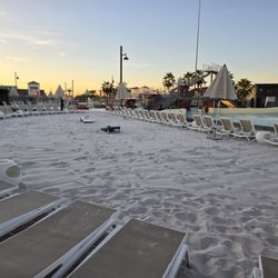 Revel Surf - Cornhole and lounge chairs