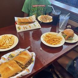 Family Cajun Kitchen - Philly poboy, hot sausage poboy, fried chicken sandwich, 1 order of cajun ranch fries, 2 orders of fries and 3 fountain drinks