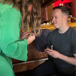 My brother proposing in the back room. My brother proposing in the back room.