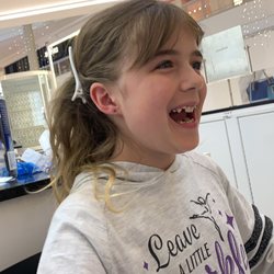 Piercing Pagoda 2553 - So happy to have her ears pierced.