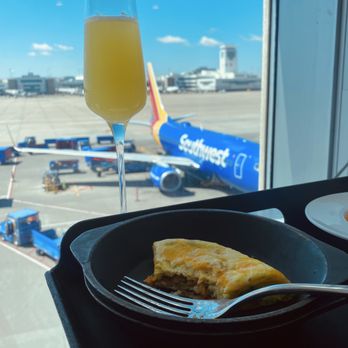 The Centurion Lounge - Egg dish, mimosa, and airplanes - Airport Lounges Near Me - Denver, Colorado