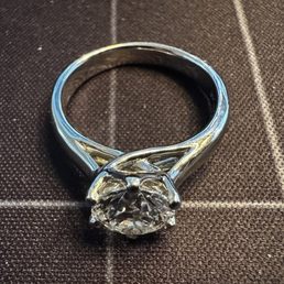 1.7 ct solitaire in a platinum trellis setting 1.7 ct solitaire in a platinum trellis setting