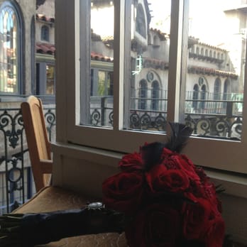 Riverside Mission Florist - Bridal bouquet. All red roses, wrapped in black satin ribbon, adorned with black feathers. - Florists Near Me - Riverside, California Riverside Mission Florist - Bridal bouquet. All red roses, wrapped in black satin ribbon, adorned with black feathers. - Florists Near Me - Riverside, California