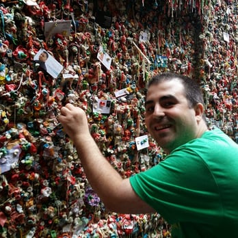 The Gum Wall - Me putting my piece on the wall. - Local Flavor Near Me - Seattle, Washington