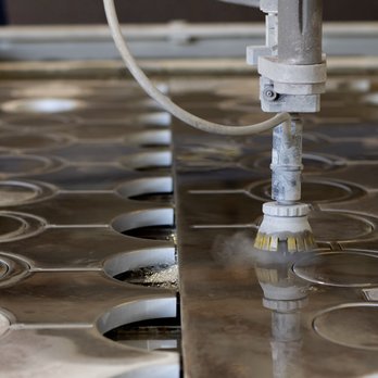 Muse & Co. Fabrication - Our Flow Mach 100 3-axis Waterjet has a 6'x12' cutting envelope - Metal Fabricators Near Me Muse & Co. Fabrication - Our Flow Mach 100 3-axis Waterjet has a 6'x12' cutting envelope - Metal Fabricators Near Me