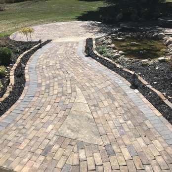Penning Landscape Services - a brick walkway in a garden - Landscaping Near Me Penning Landscape Services - a brick walkway in a garden - Landscaping Near Me