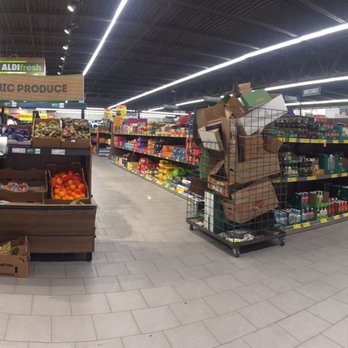 ALDI - View from store corner. All produce in cases or in inviting "farmer's market" style. - Grocery Near Me - Wixom, Michigan