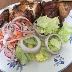 El Pollon II - Half chicken with the side salad and tomato and onion salad