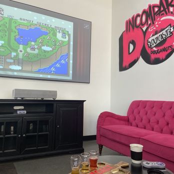 Outcast Doughnuts - Super NES on hot pink couches. - Donuts Near Me - Mesa, Arizona Outcast Doughnuts - Super NES on hot pink couches. - Donuts Near Me - Mesa, Arizona