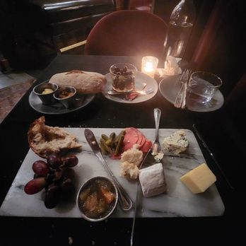 LeTour - The cheese board is extravagant comes with 3 cheeses, crispy bread, jam, pickles, turnips, and grapes - French Near Me - Evanston, Illinois