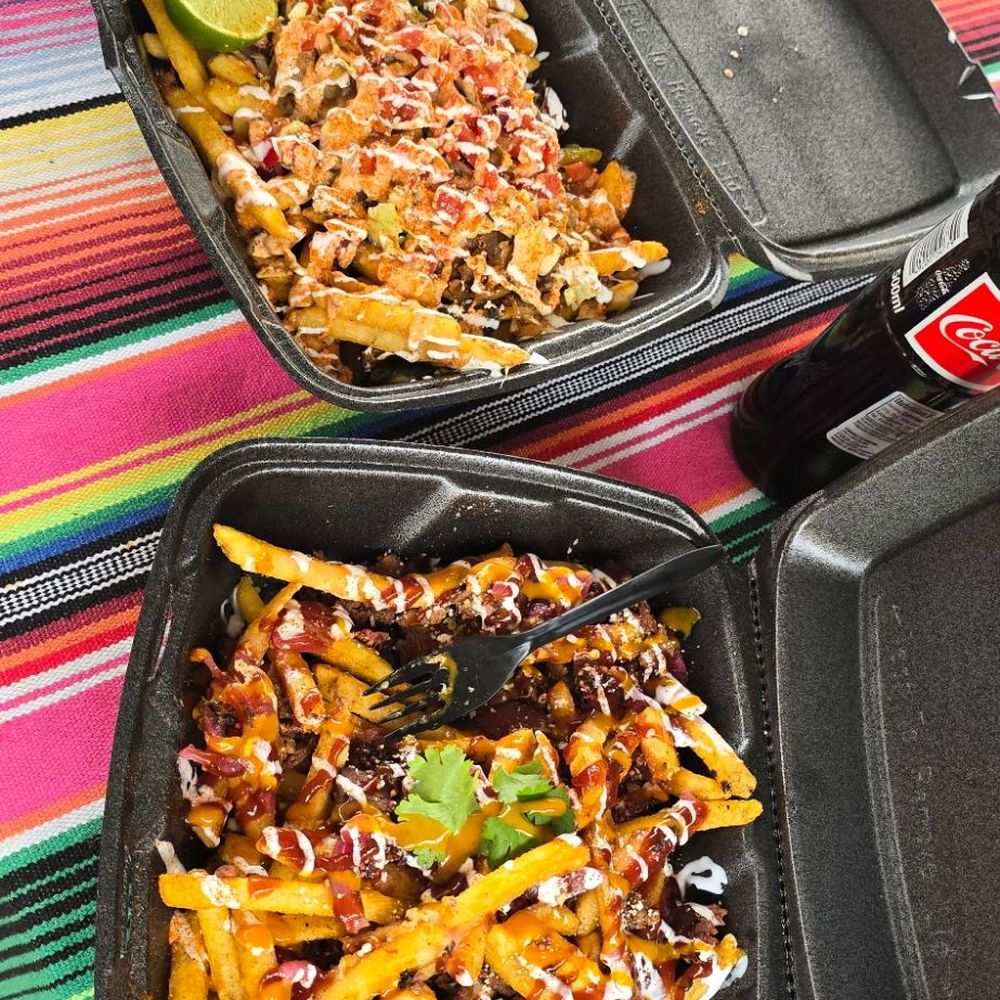 Green Chili Carne Asada Taco Two Step Brisket Taco We leveled all the way up and ordered our tacos over a half-order of fried Green Chili Carne Asada Taco Two Step Brisket Taco We leveled all the way up and ordered our tacos over a half-order of fried