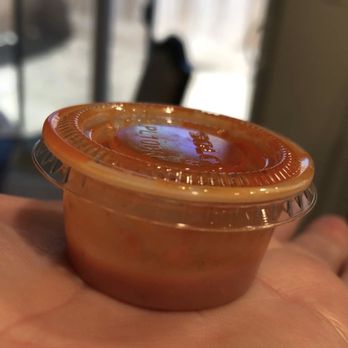 La Barca Famous Tortas - a hand holding a plastic container - Mexican Near Me - Delano, California La Barca Famous Tortas - a hand holding a plastic container - Mexican Near Me - Delano, California