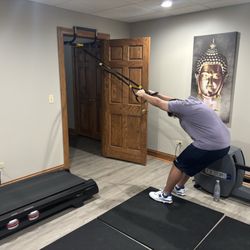 Weightloss Transformation In-Home Personal Training  - TRX and Pull up bar.  The options are limitless for this In-home set up.