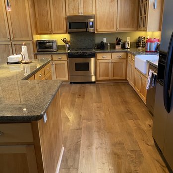 Premier Floor Covering - a kitchen with wood cabinets and stainless steel appliances - Carpeting Near Me - Grass Valley, California Premier Floor Covering - a kitchen with wood cabinets and stainless steel appliances - Carpeting Near Me - Grass Valley, California