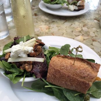 Shorehouse Kitchen - Chicken burrata pistachio and pesto sandwich split with a side salad. - Breakfast & Brunch Near Me - Carlsbad, California Shorehouse Kitchen - Chicken burrata pistachio and pesto sandwich split with a side salad. - Breakfast & Brunch Near Me - Carlsbad, California