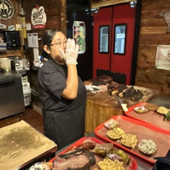 Terry Black's Barbecue - Cutting the meat - Barbeque Near Me - Austin, Texas Terry Black's Barbecue - Cutting the meat - Barbeque Near Me - Austin, Texas