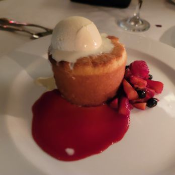 Ocean Prime - Warm Butter Cake with berries, vanilla ice cream and rasberry sauce - Seafood Near Me - Phoenix, Arizona