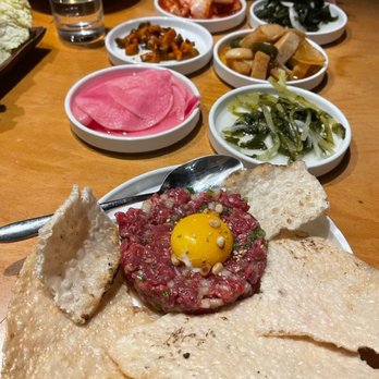 Meet Korean BBQ - Beef tartare with an assortment of refillable side dishes - Barbeque Near Me - Seattle, Washington