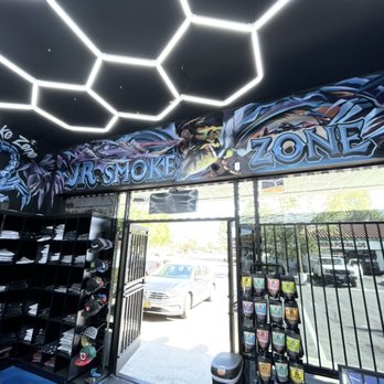 JR Smoke Zone - REKOIL signs zig zag man - Vape Shops Near Me - Camarillo, California