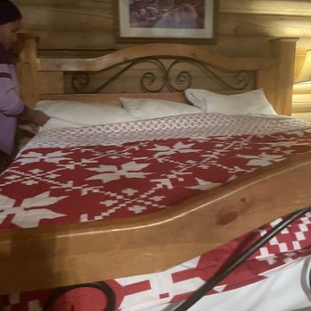 Mt Charleston Lodge Cabins - One of the king beds in cabin 14 decorated with a blanket we brought up. - Hotels Near Me - Las Vegas, Nevada Mt Charleston Lodge Cabins - One of the king beds in cabin 14 decorated with a blanket we brought up. - Hotels Near Me - Las Vegas, Nevada