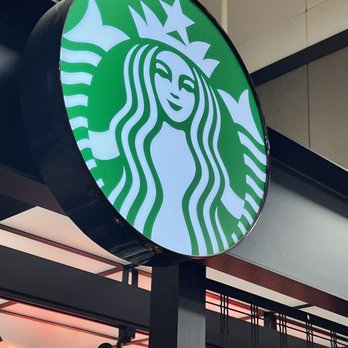 Starbucks - a starbucks sign in a mall - Coffee & Tea Near Me - Everett, Washington