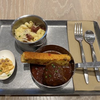 Capital One Lounge - Top: bacon mac and cheese
Bottom: chipotle deviled egg, bourbon-glazed meatball - Airport Lounges Near Me - Dallas, Texas Capital One Lounge - Top: bacon mac and cheese
Bottom: chipotle deviled egg, bourbon-glazed meatball - Airport Lounges Near Me - Dallas, Texas