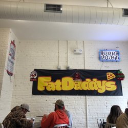 Fat Daddy’s Pizza - Seating area and sign