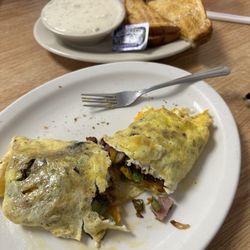 Debbie's Restaurant - 3 egg omelette with sausage, ham, onions, green peppers & cheese, sausage gravy and toast.