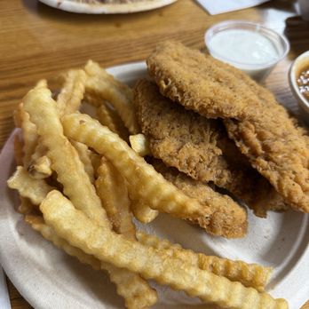 Lexington Barbecue - Chicken tenders and fries. Chopped plate in the background. - Barbeque Near Me - Lexington, North Carolina Lexington Barbecue - Chicken tenders and fries. Chopped plate in the background. - Barbeque Near Me - Lexington, North Carolina