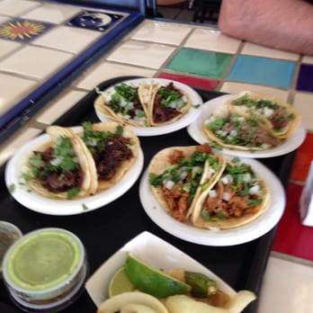 Restaurant Atoyac Estilo Oaxaca - 4 cabeza, 2 lengua, two pastor tacos, with side salsas, sauteed onions, a jalapeño, and limes. - Mexican Near Me - Phoenix, Arizona
