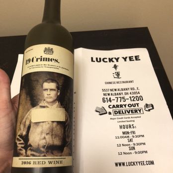 Lucky Yee - a hand holding a bottle of wine - Chinese Near Me - New Albany, Ohio Lucky Yee - a hand holding a bottle of wine - Chinese Near Me - New Albany, Ohio