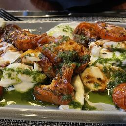 The winter caprese, basil oil | roasted tomato | aged balsamic | house made mozzarella