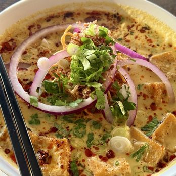 Something Vegan - Khao Soi with Fried Tofu. The tastiest dish we ordered. Good balance of sweet and spice. Rich and satisfying coconut flavor. - Asian Fusion Near Me - Burbank, California Something Vegan - Khao Soi with Fried Tofu. The tastiest dish we ordered. Good balance of sweet and spice. Rich and satisfying coconut flavor. - Asian Fusion Near Me - Burbank, California