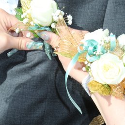 These flowers are from Smith's Food King. She took theirs apart and added the mini roses and gold leaves. Go there. Not to this place. These flowers are from Smith's Food King. She took theirs apart and added the mini roses and gold leaves. Go there. Not to this place.