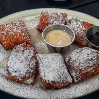 The Twins Restaurant - Beignets - light as a feather yet decadent and sinful. House made brandy sauce and jam completes the debauchery. - American Near Me - Cotati, California The Twins Restaurant - Beignets - light as a feather yet decadent and sinful. House made brandy sauce and jam completes the debauchery. - American Near Me - Cotati, California