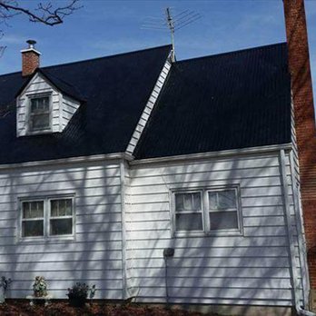 Recker Construction - a white house with a black roof - General Contractors Near Me - Dyersville, Iowa Recker Construction - a white house with a black roof - General Contractors Near Me - Dyersville, Iowa