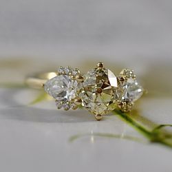 Vintage style engagement ring with old mine cut yellow diamond