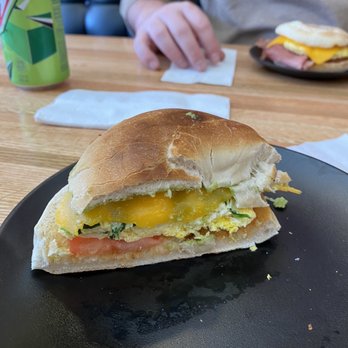 Cesaronis Cafe & Deli - a half eaten sandwich on a black plate - Cafes Near Me - Sycamore, Illinois
