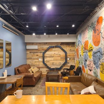 Indah Coffee - a coffeehouse with a mural on the wall - Coffee Roasteries Near Me - Columbia, South Carolina