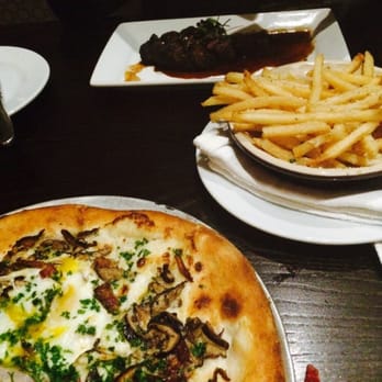 The Manship Wood Fired Kitchen - Mushroom, bacon and egg wood fired pizza and a side of parm reggiano fries - New American Near Me - Jackson, Mississippi