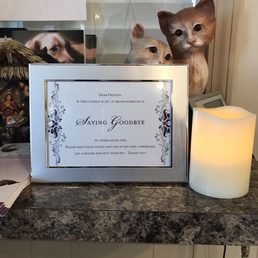 This shows their commitment to their animals. When an animal is being put down, the candle is lit. The sign asks for quiet.