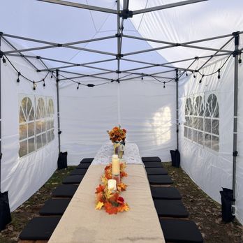 La Fiesta Rentals - Inside of the tent, I fit two picnic tables lined up in a row. - Bounce House Rentals Near Me La Fiesta Rentals - Inside of the tent, I fit two picnic tables lined up in a row. - Bounce House Rentals Near Me